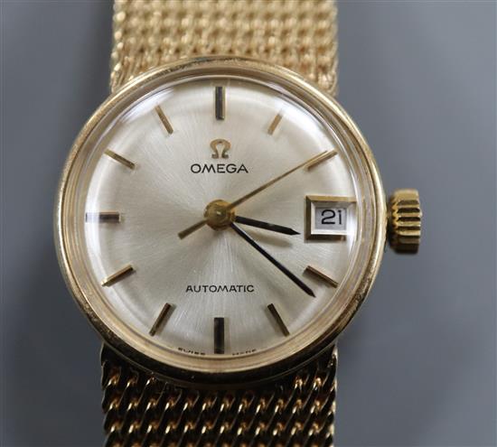 A ladys 1960s 9ct gold Omega automatic wrist watch, on integral 9ct gold Omega bracelet, gross weight 38 grams.